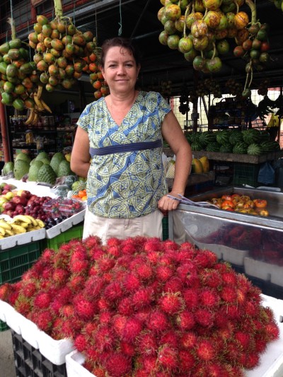 woman selling tropical fruits